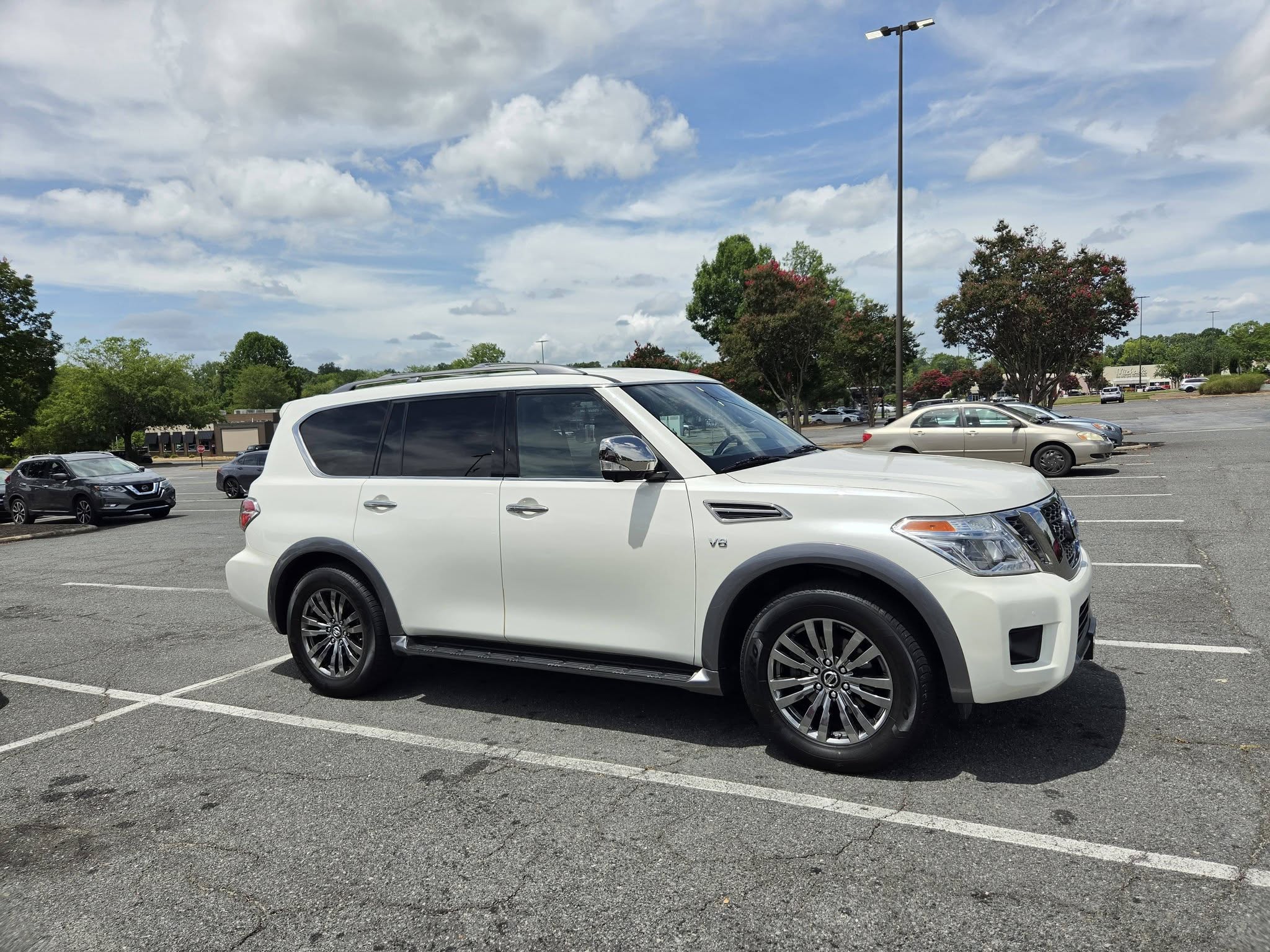 White Nissan Armada SUV side view